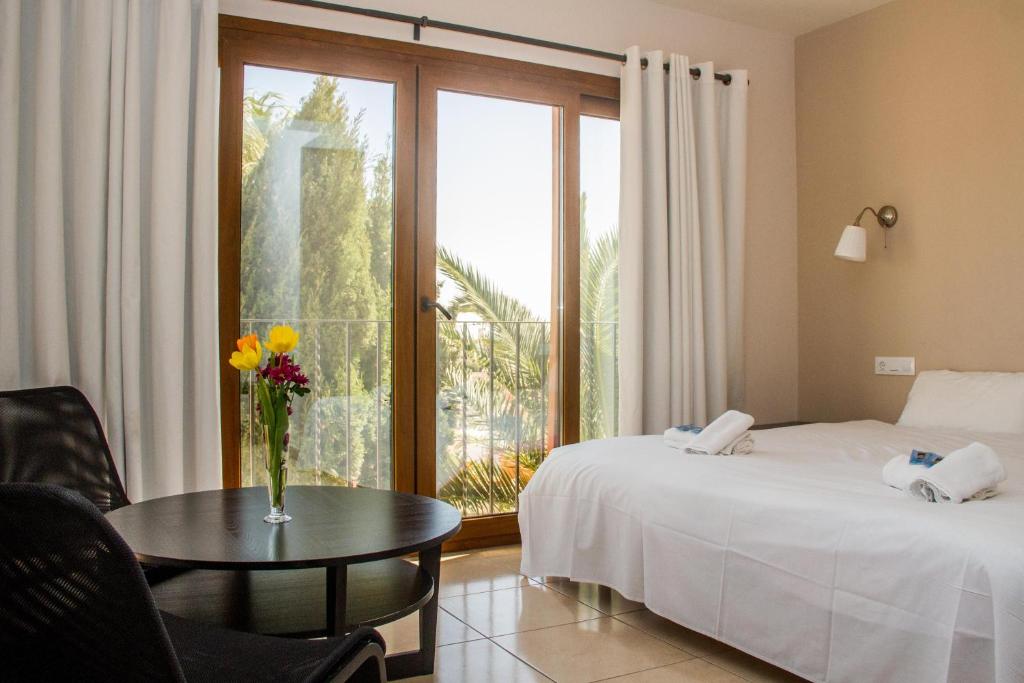 Postel nebo postele na pokoji v ubytování Hostal Gran Sol