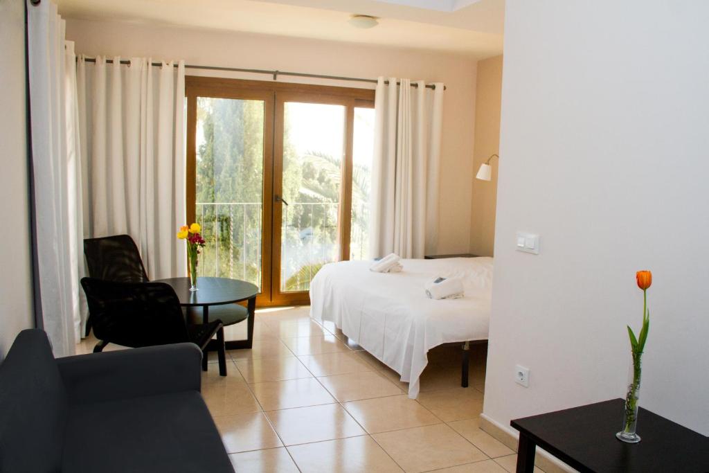 Postel nebo postele na pokoji v ubytování Hostal Gran Sol