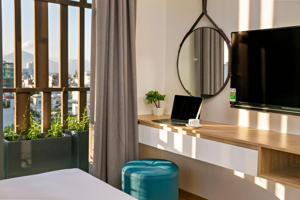TV a/nebo společenská místnost v ubytování Dolphin Hotel and Apartment