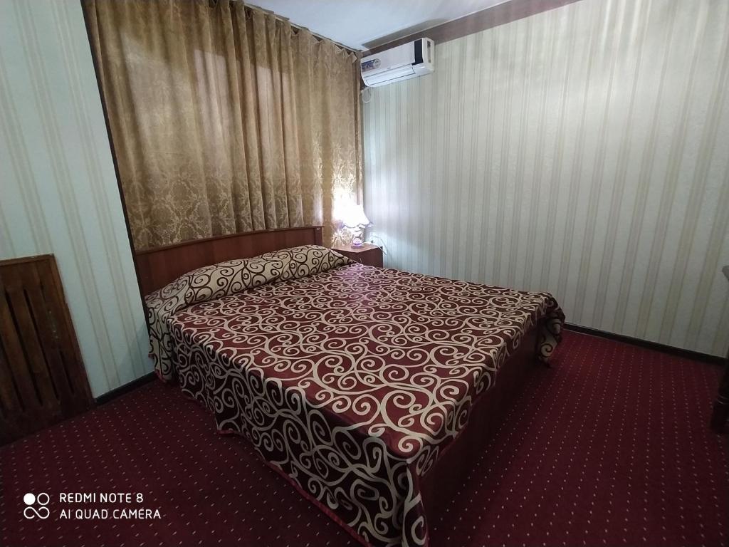Кровать или кровати в номере Silver Hotel