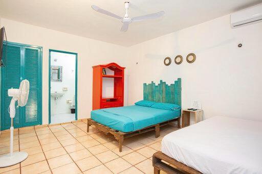 Postel nebo postele na pokoji v ubytování Casa Cálido Hotel