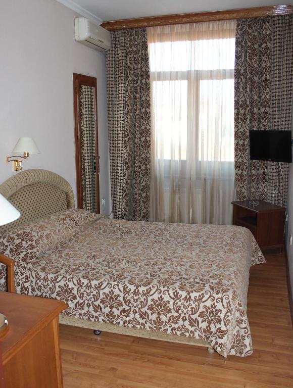 Postel nebo postele na pokoji v ubytování Domus Hotel-1