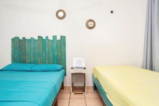 Postel nebo postele na pokoji v ubytování Casa Cálido Hotel