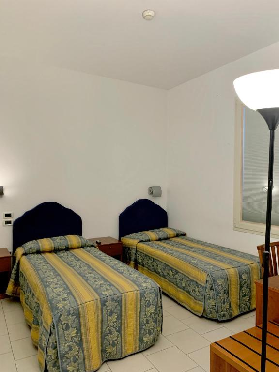 Postel nebo postele na pokoji v ubytování Hotel Riverside