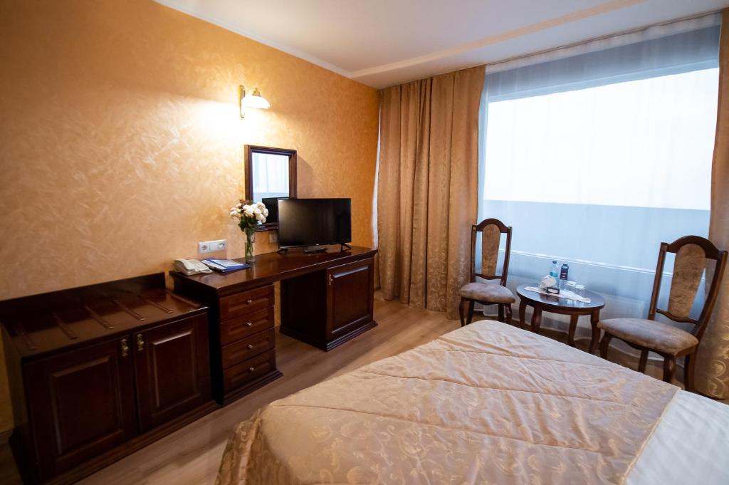 Postel nebo postele na pokoji v ubytování Salute Hotel