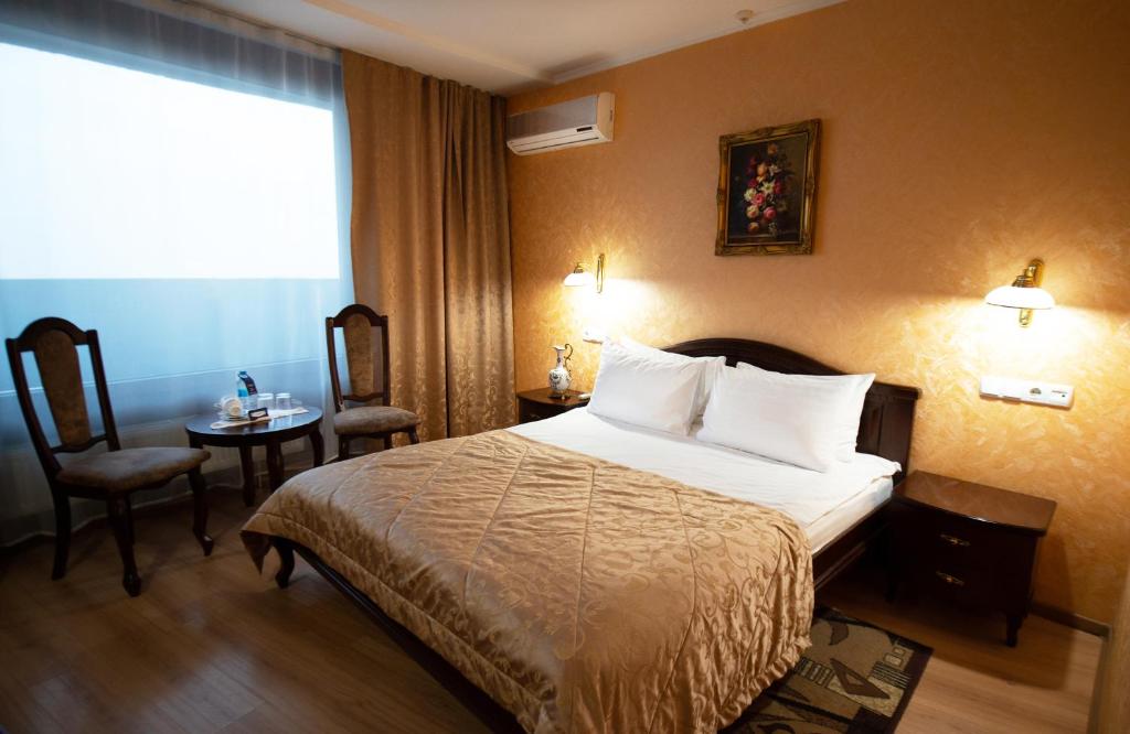Postel nebo postele na pokoji v ubytování Salute Hotel