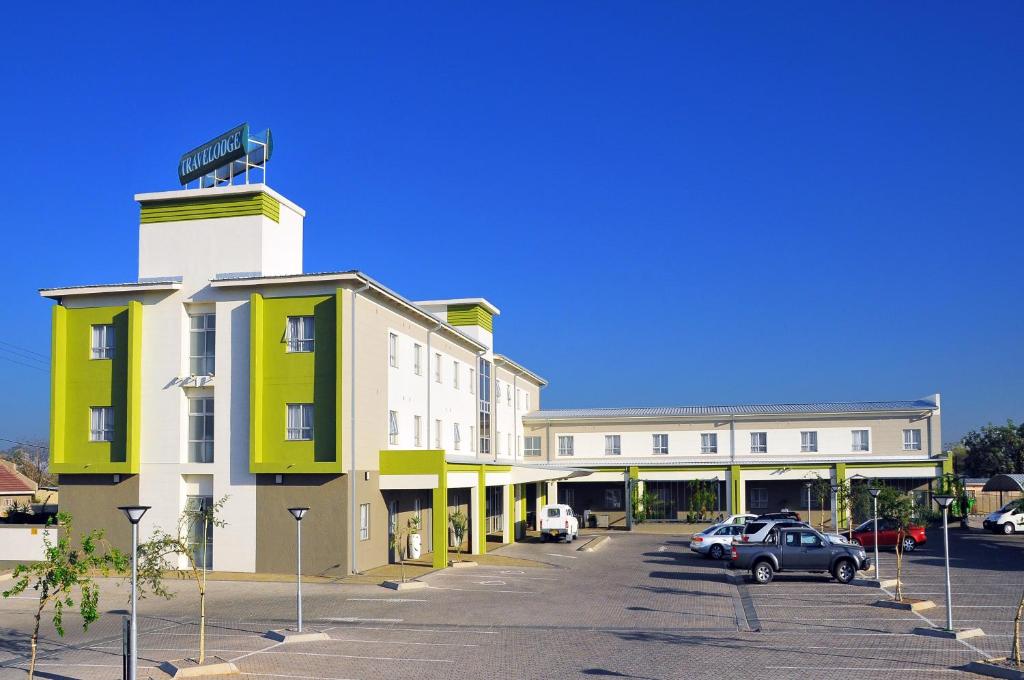 a building with a street sign on top of it at Travelodge in Gaborone