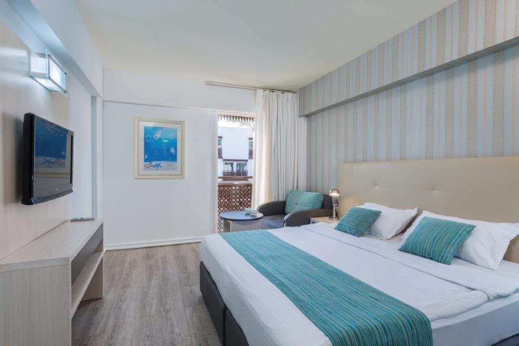 Postel nebo postele na pokoji v ubytování G hotel
