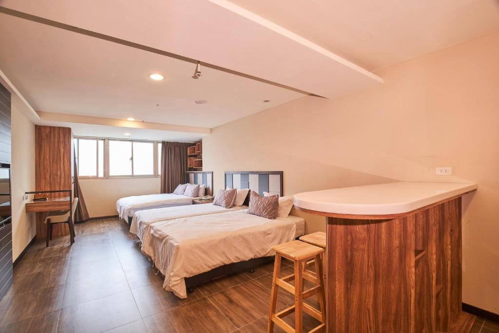 Postel nebo postele na pokoji v ubytování Greeninn Hotel