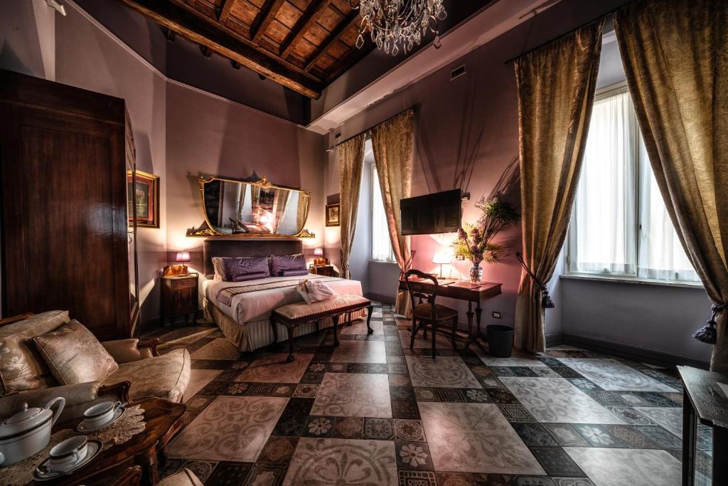 Posteľ alebo postele v izbe v ubytovaní Navona Grand Suite