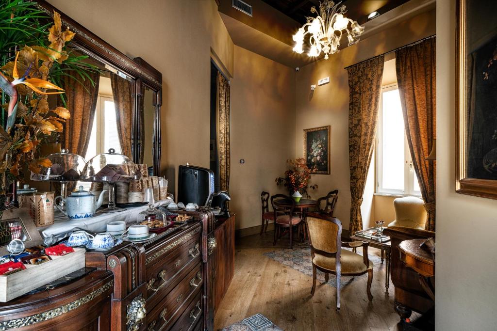 Televízia a/alebo spoločenská miestnosť v ubytovaní Navona Grand Suite
