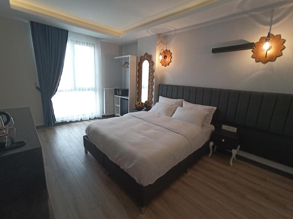 Postel nebo postele na pokoji v ubytování Avcılar Garden Hotel
