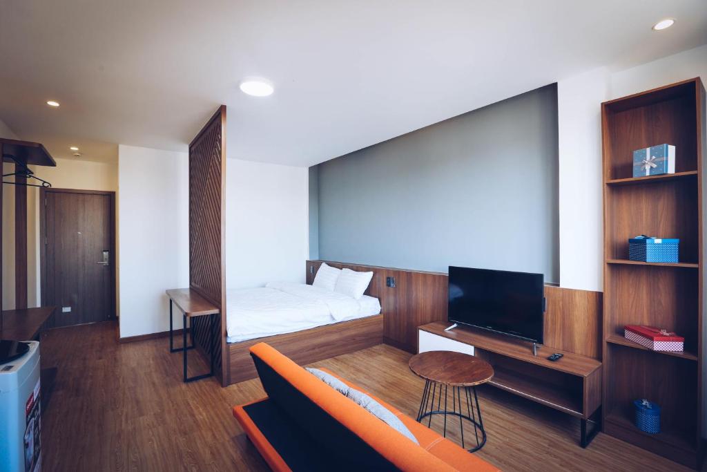 TV a/nebo společenská místnost v ubytování TTR Studio Apart Hotel