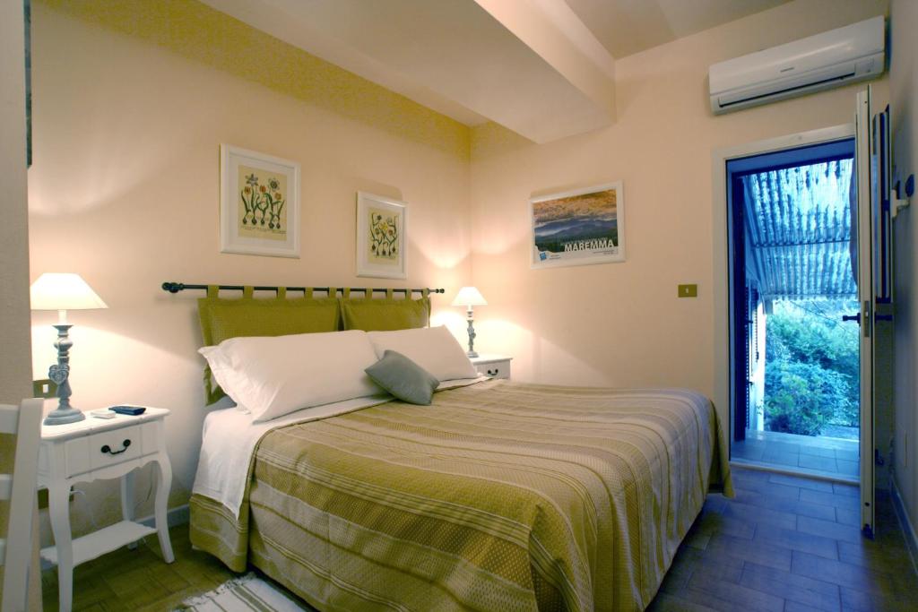 Postel nebo postele na pokoji v ubytování Agriturismo Peretti