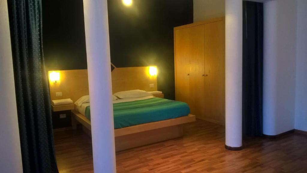 Postel nebo postele na pokoji v ubytování Bellaria Relais