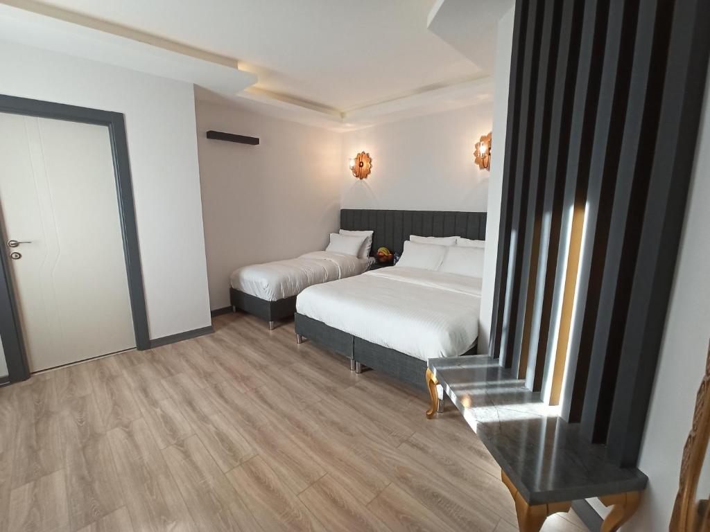 Postel nebo postele na pokoji v ubytování Avcılar Garden Hotel
