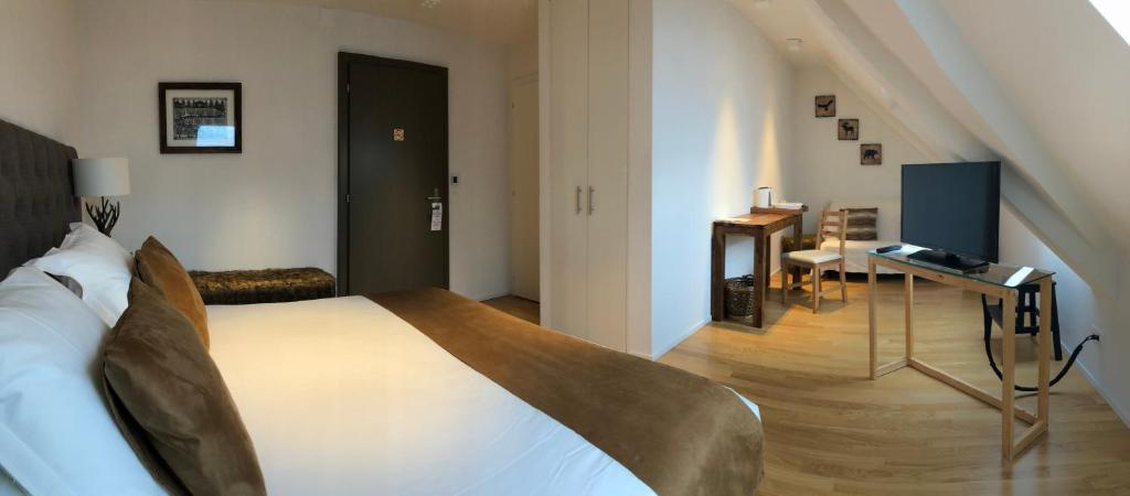 Postel nebo postele na pokoji v ubytování L’Auberge de Mézières