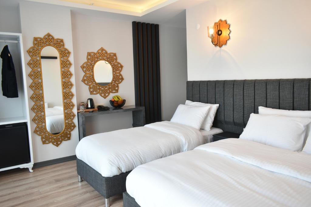 Postel nebo postele na pokoji v ubytování Avcılar Garden Hotel