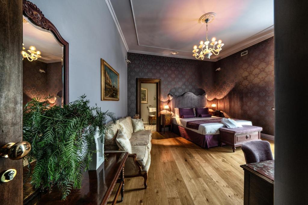 Posteľ alebo postele v izbe v ubytovaní Navona Grand Suite