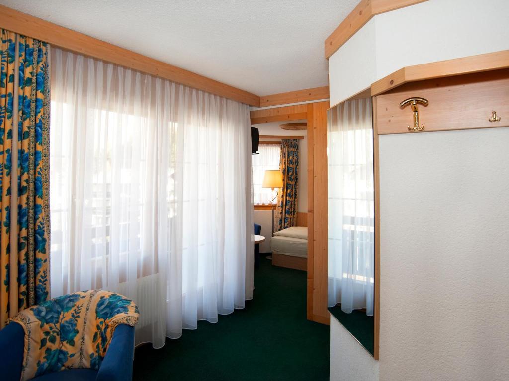Postel nebo postele na pokoji v ubytování Hotel Ambiente