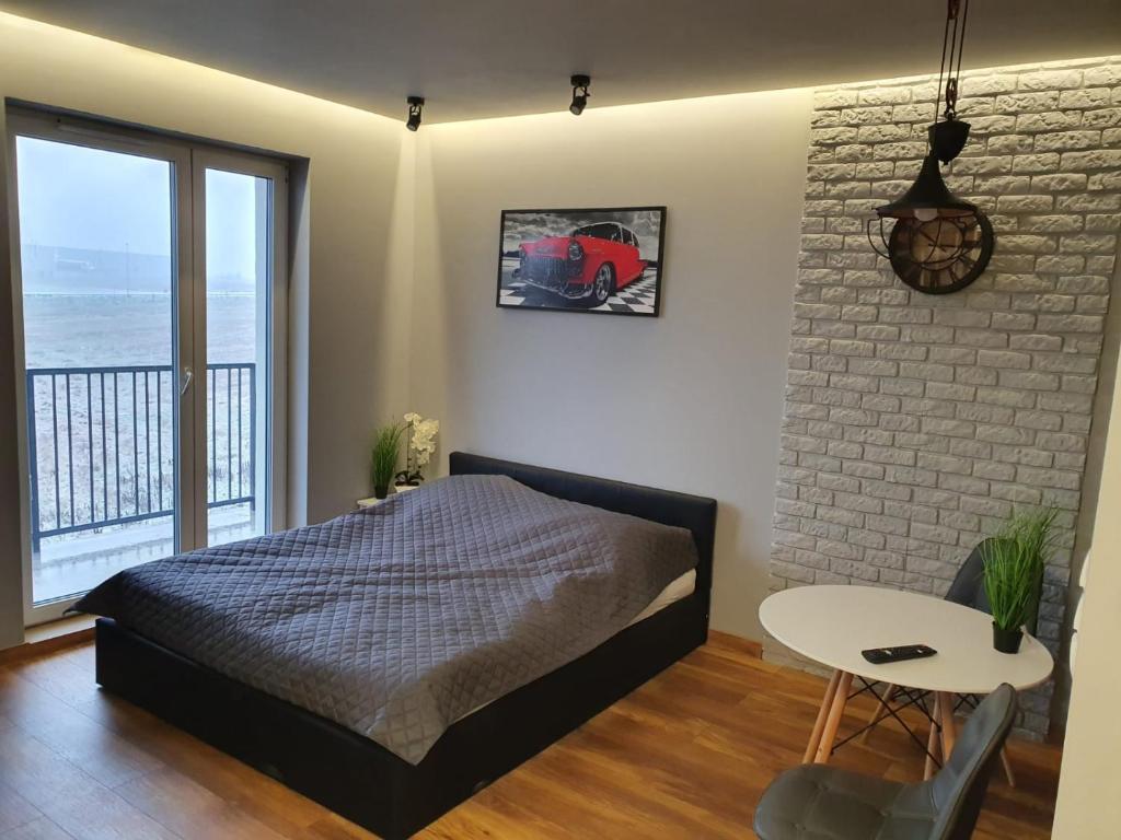 Posteľ alebo postele v izbe v ubytovaní Nowe Apartamenty Iława Odnowiciela z klimatyzacją