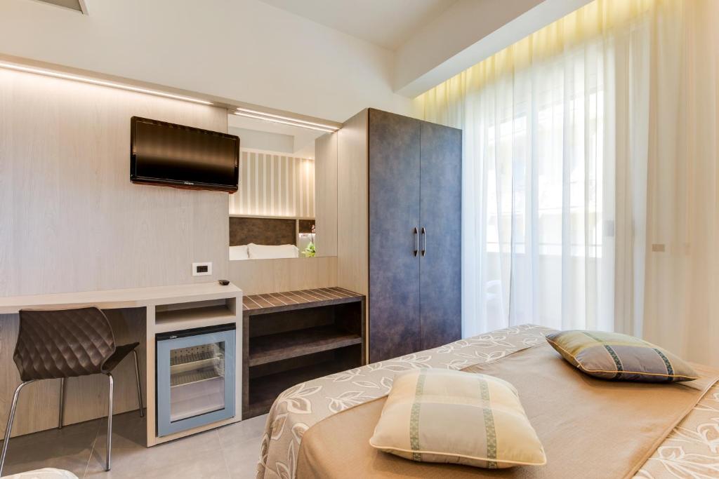 Postel nebo postele na pokoji v ubytování Hotel Cavour
