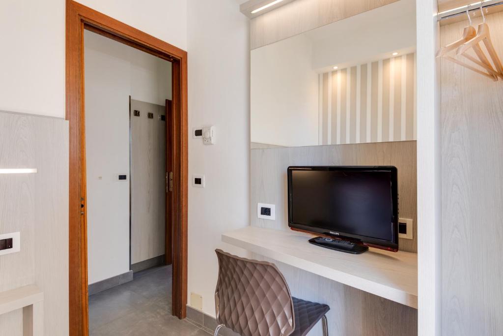 TV a/nebo společenská místnost v ubytování Hotel Cavour