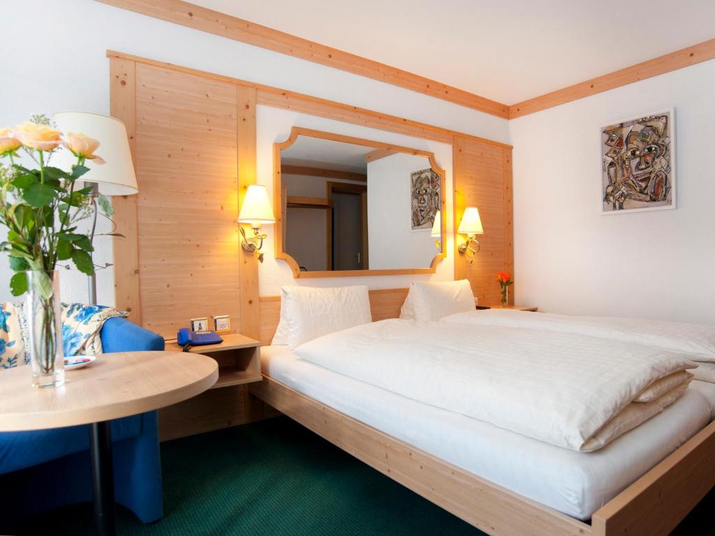 Postel nebo postele na pokoji v ubytování Hotel Ambiente