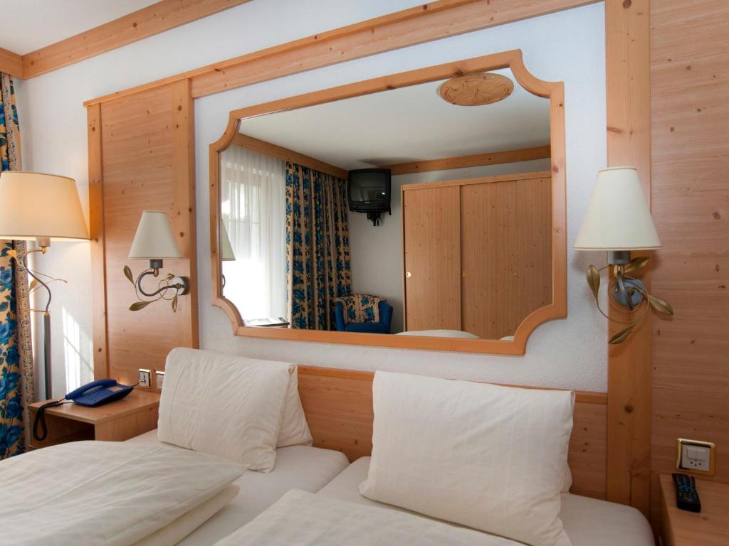 Postel nebo postele na pokoji v ubytování Hotel Ambiente