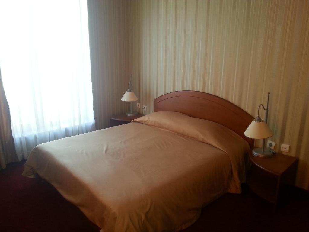 Postel nebo postele na pokoji v ubytování Hotel Perperikon