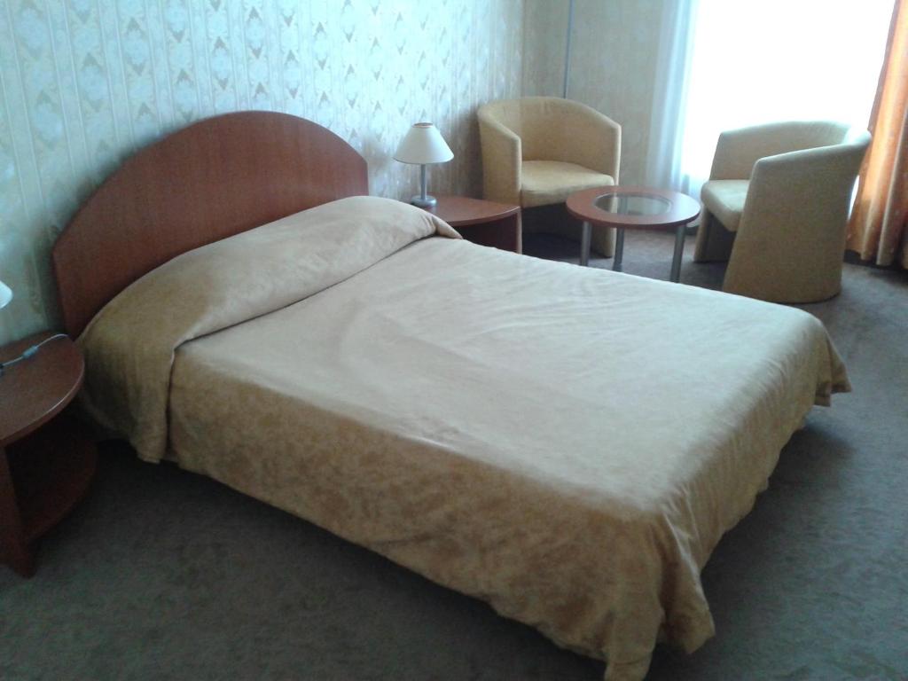 Postel nebo postele na pokoji v ubytování Hotel Perperikon