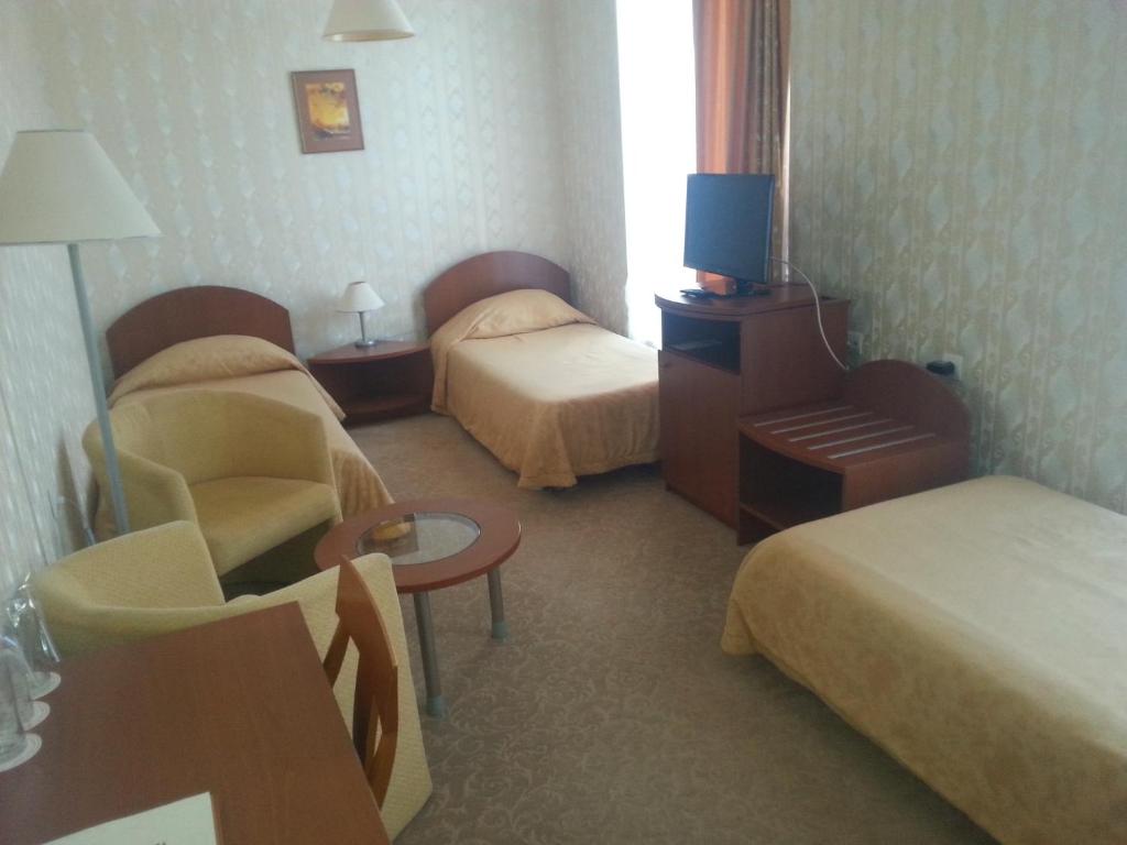 Postel nebo postele na pokoji v ubytování Hotel Perperikon
