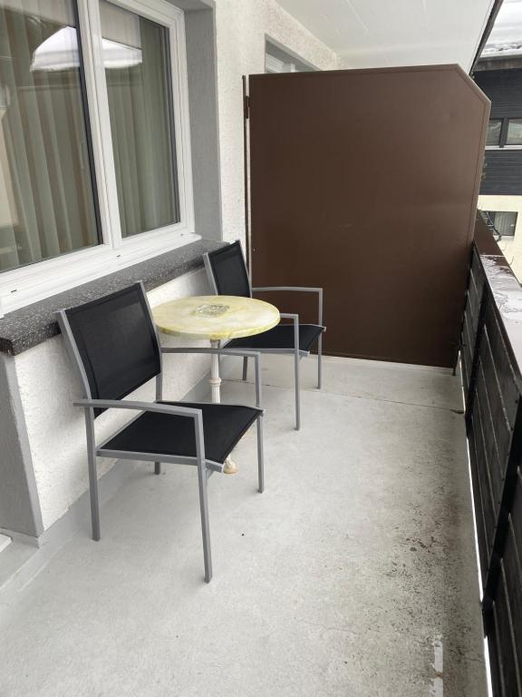 Uma área de estar em Hotel Adonis