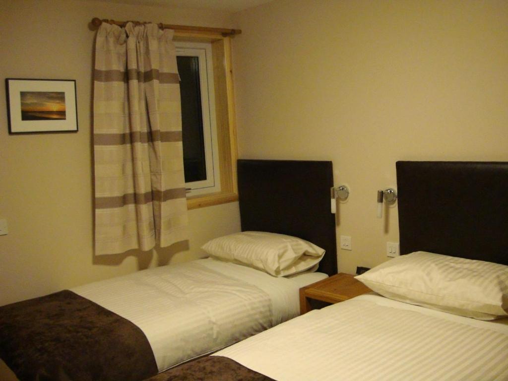 Letto o letti in una camera di Seaview John O Groats Hotel