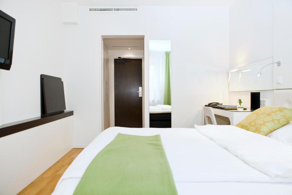 TV a/nebo společenská místnost v ubytování Elite Hotel Arcadia