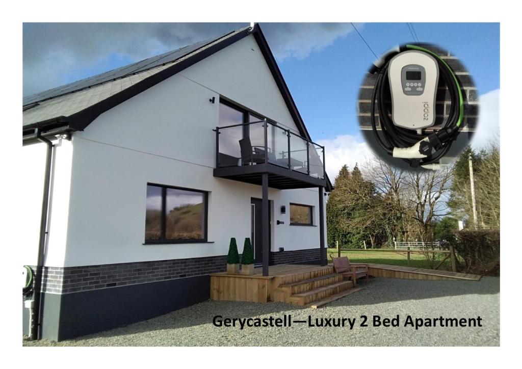 uma representação de uma pequena casa com um anexo para cães em Gerycastell Luxury Holiday Apartment with Stunning Views & EV Station Point em Carmarthen