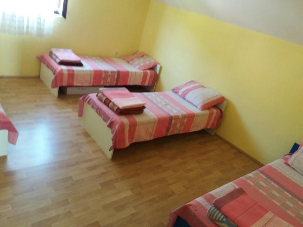 Postel nebo postele na pokoji v ubytování Guesthouse Tomasevic