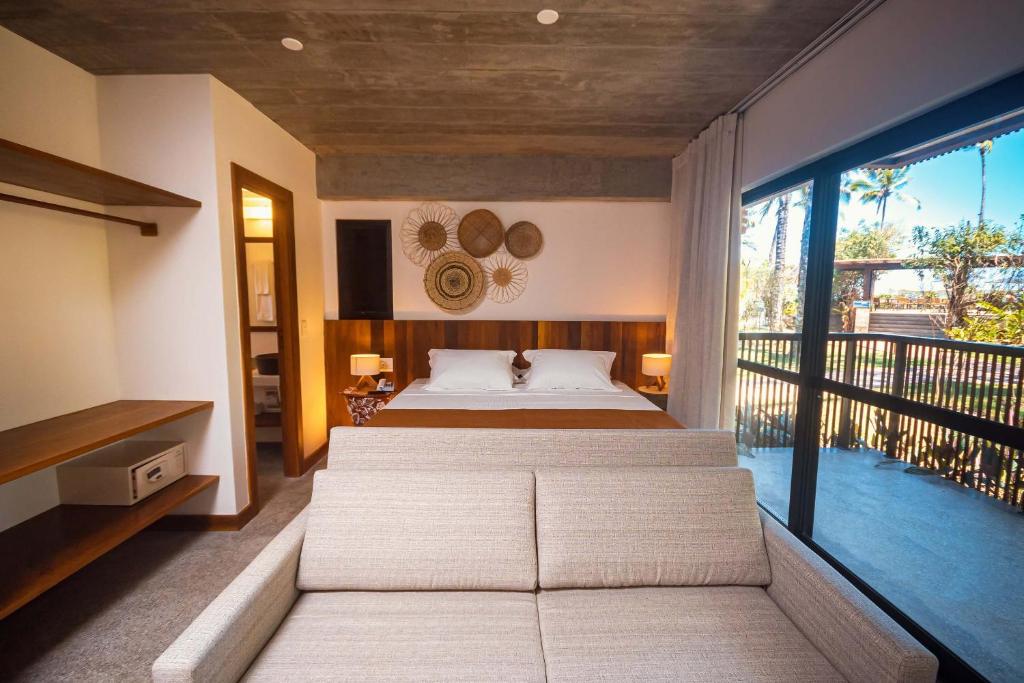 Cama ou camas em um quarto em Aldeia do Mar Hotel