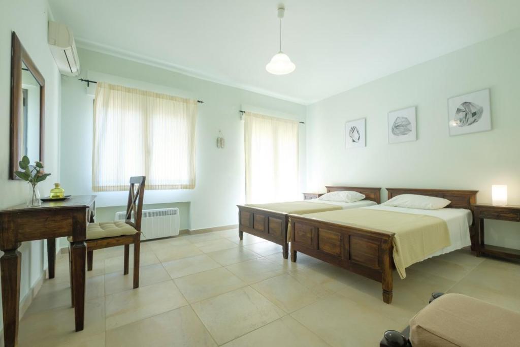 Posteľ alebo postele v izbe v ubytovaní Trochalo Villas