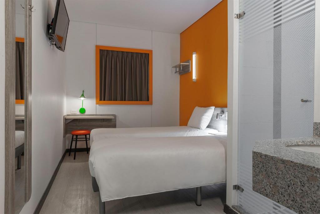 Postel nebo postele na pokoji v ubytování ibis budget Barranquilla