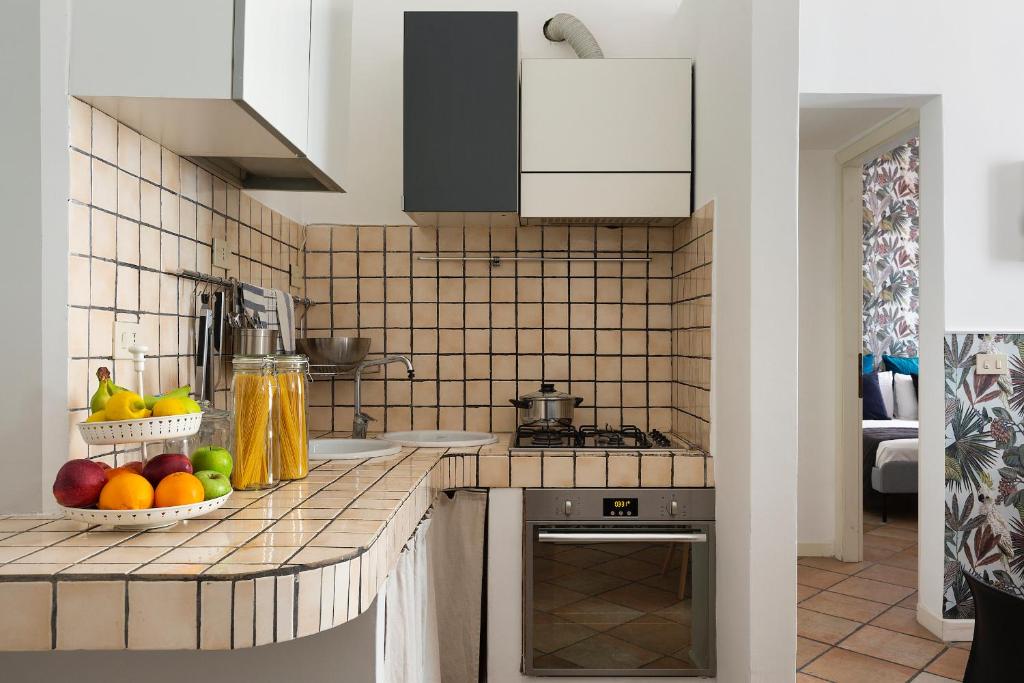 Kuchyňa alebo kuchynka v ubytovaní Gianicolo Jungle Apartment - Onofrio