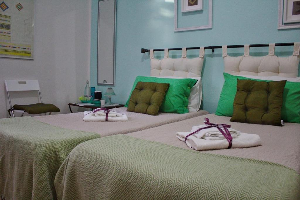 En eller flere senge i et værelse på La Collina dei Ciliegi