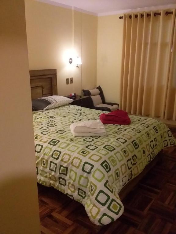 Postel nebo postele na pokoji v ubytování Hostal Nichkito