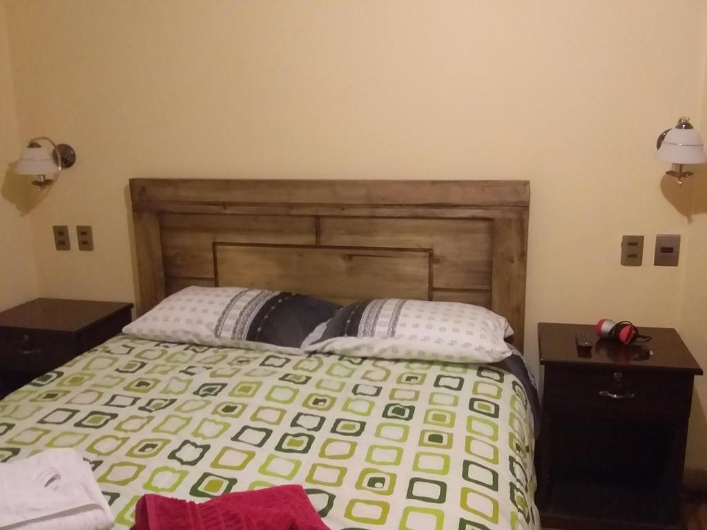 Postel nebo postele na pokoji v ubytování Hostal Nichkito