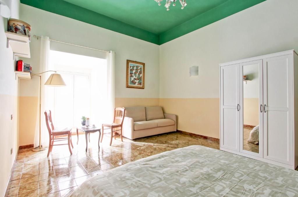 a living room with a couch and a table at Roman Apartment in Rome