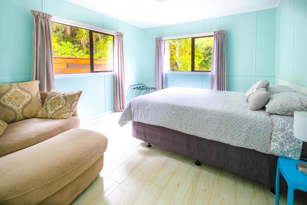 Postel nebo postele na pokoji v ubytování Kiwi Call Cottage