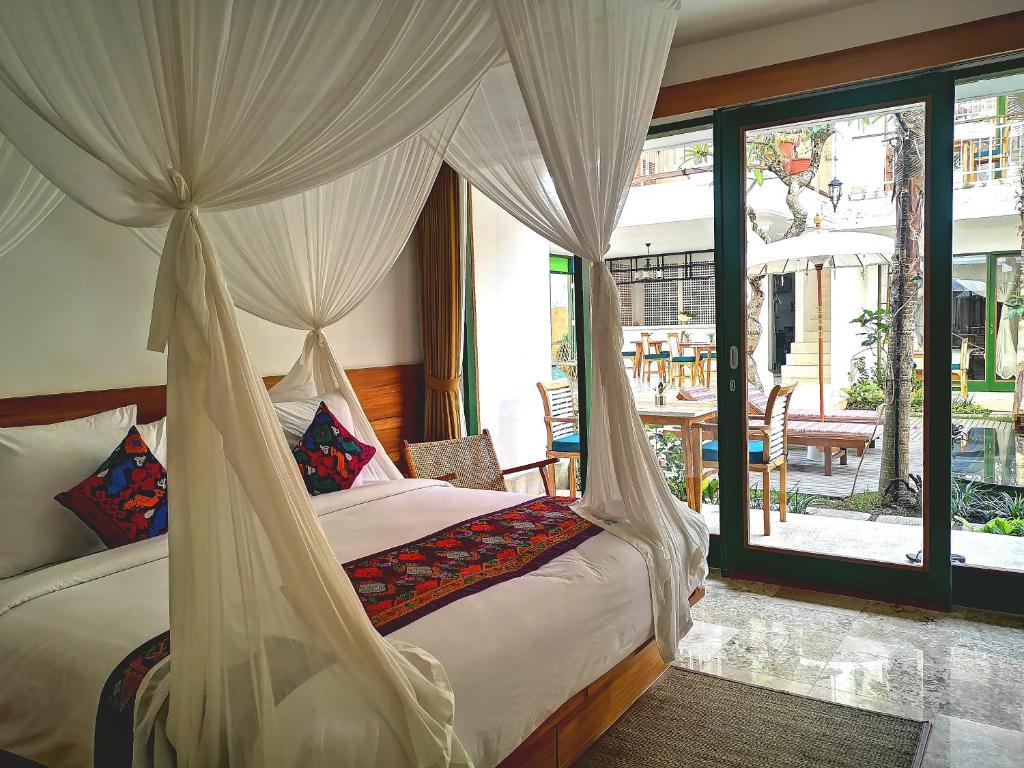 Postel nebo postele na pokoji v ubytování Sabana Ubud