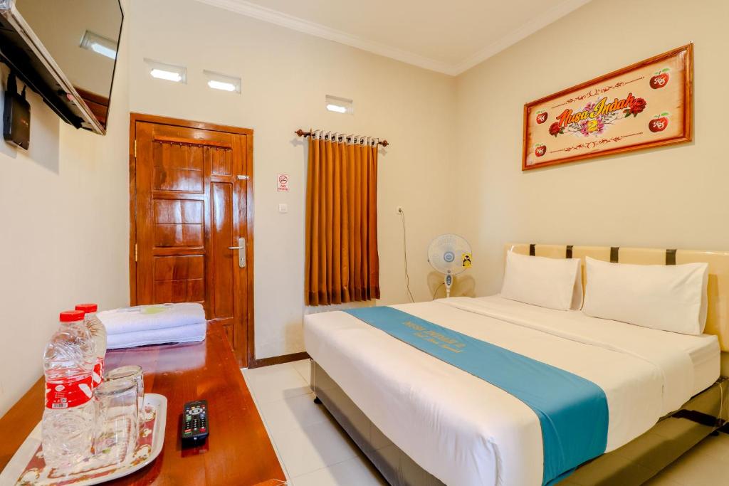 เตียงในห้องที่ Guesthouse Nusa Indah Syariah 2