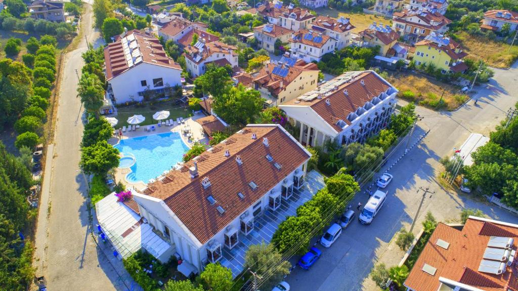 an aerial view of a house with a swimming pool at Göcek Lykia Resort Premium Concept Hotel in Göcek