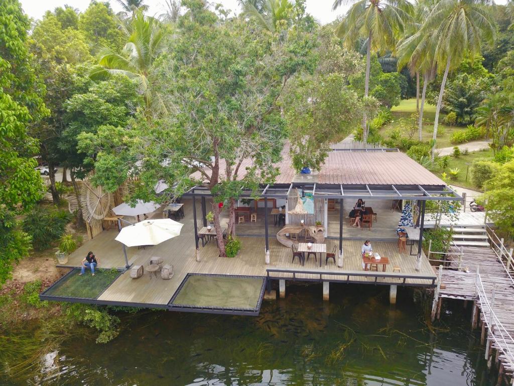 an aerial view of a house on the water at Awana Villa Resort Yaonoi - SHA Extra Plus in Ko Yao Noi